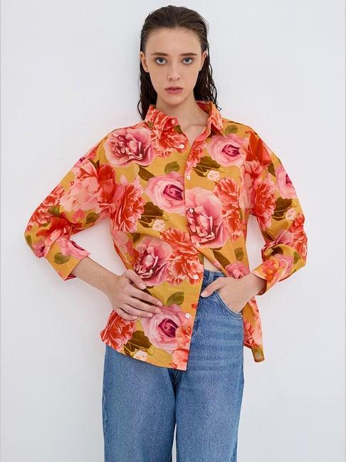 cover story orange floral print shirt