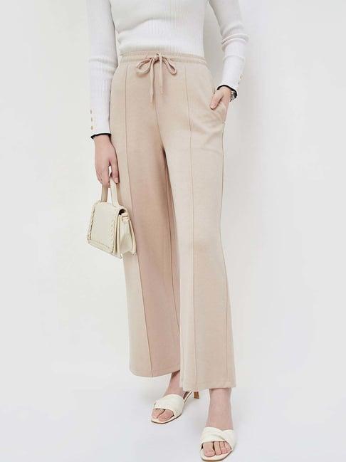 code by lifestyle beige mid rise flared pants