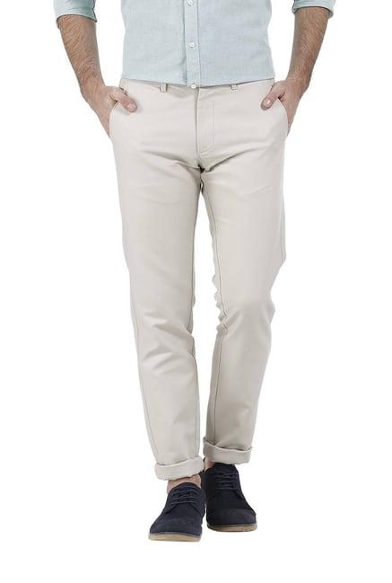 basics ecru solid tapered fit trousers