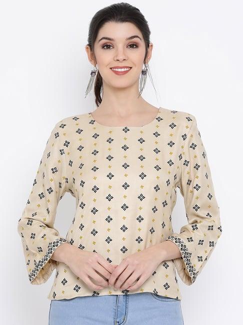 rooted beige embroidered top