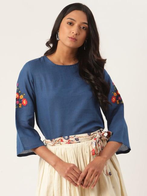 rooted blue embroidered top