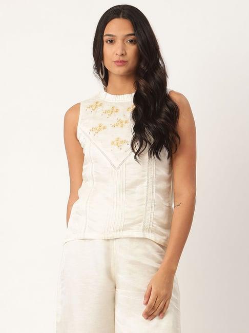 rooted white embroidered top