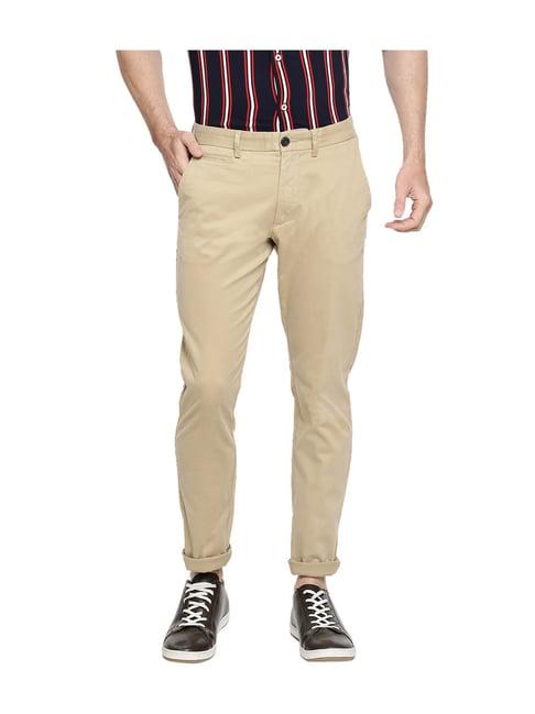 celio* beige mid rise solid trousers