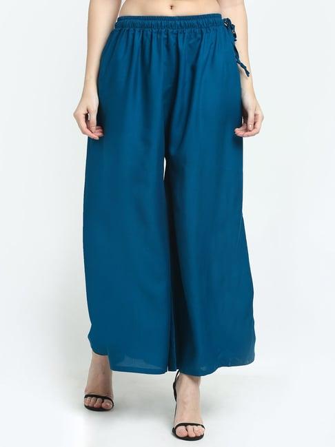 women english blue excess flared rayon palazzo with fully elasticated waistband, slip on closure, drawstrings at the side along with 2 pockets on the side.