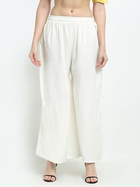 women off white excess flared rayon palazzo with fully elasticated waistband, slip on closure, drawstrings at the side along with 2 pockets on the side.