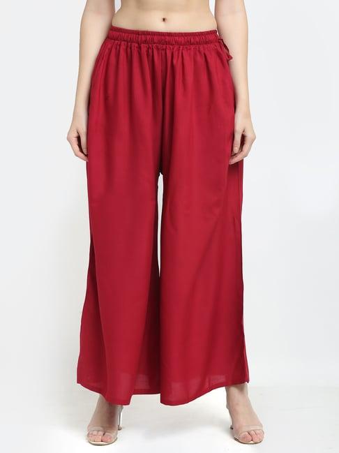 women maroon excess flared rayon palazzo with fully elasticated waistband, slip on closure, drawstrings at the side along with 2 pockets on the side.