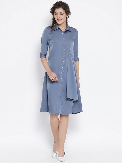 office & you blue dress with grey flower bunch brooch