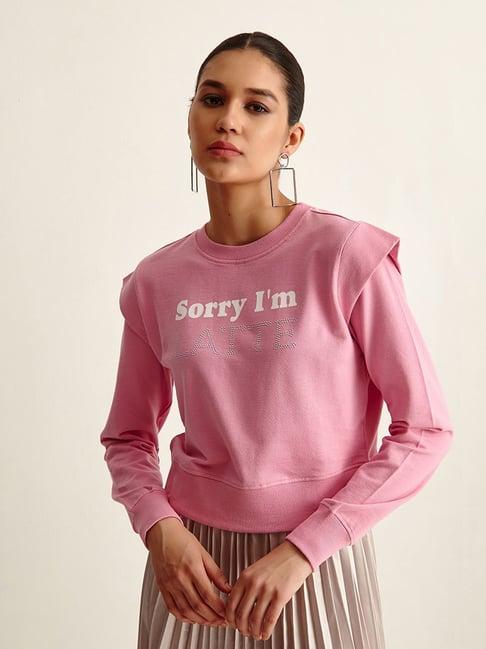 cover story pink cotton graphic print sweater