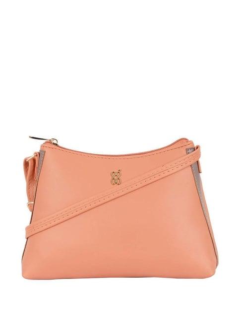 baggit peach solid medium sling handbag