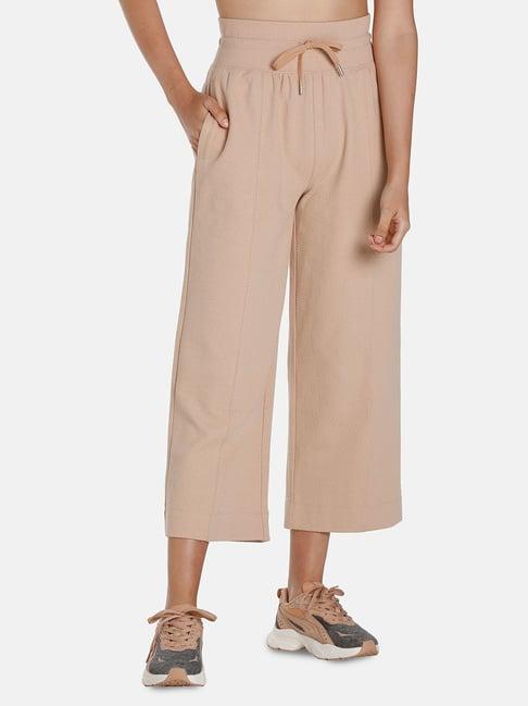 puma tan regular fit mid rise trousers