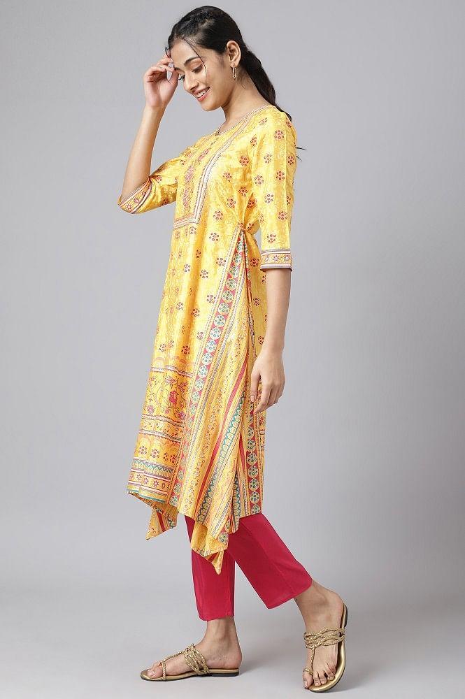 liva yellow asymmetric kurta with pink trouser and dupatta