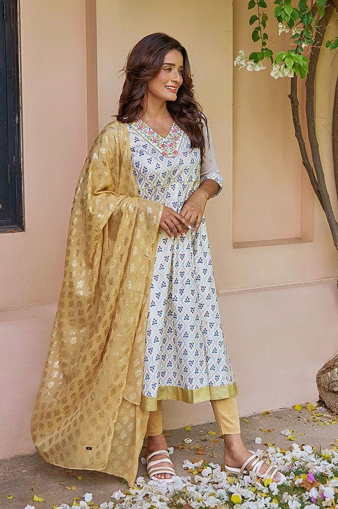 white zari embroidered kurta with golden tights and printed dupatta